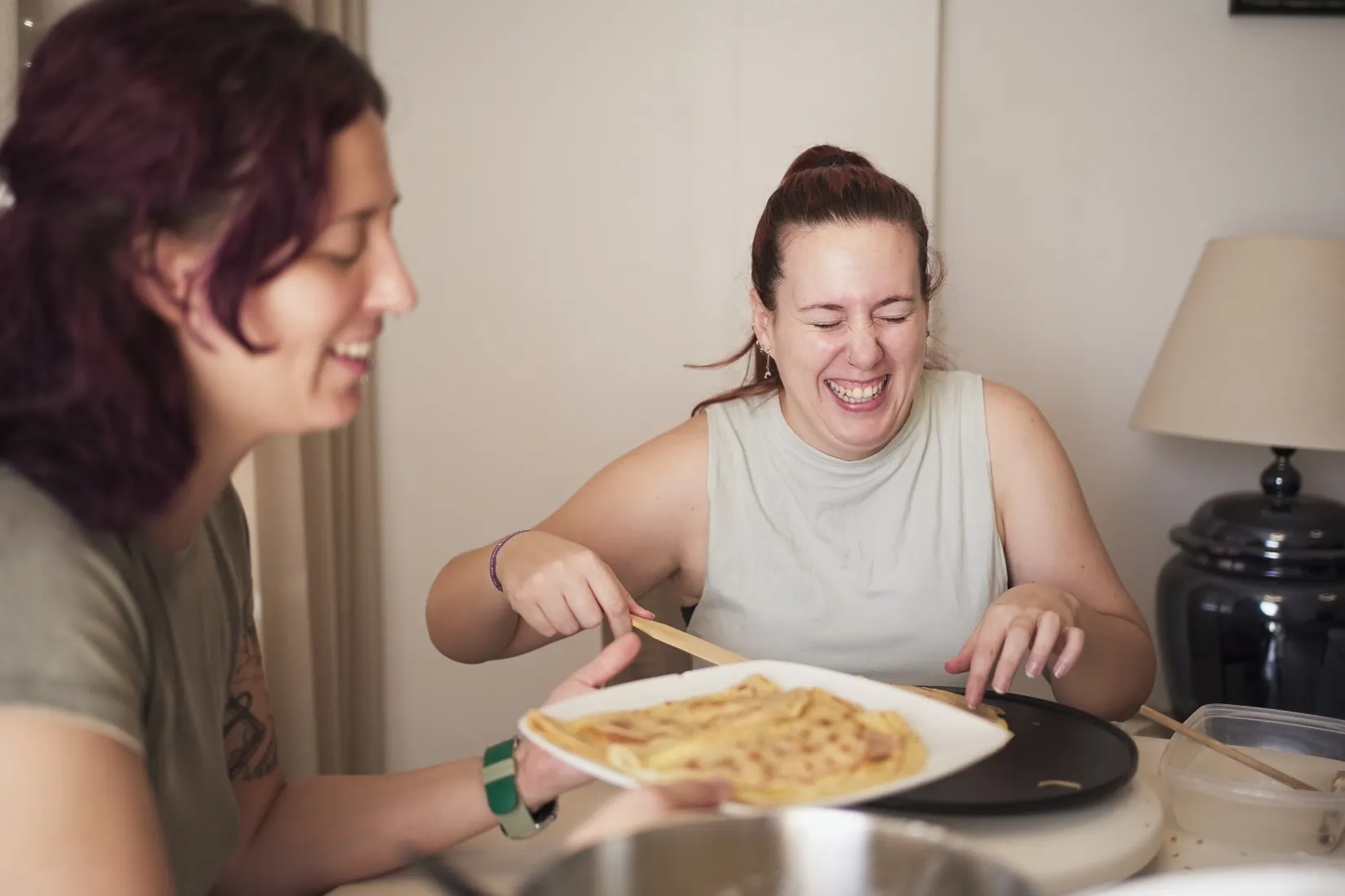 Two friends cooking a meal